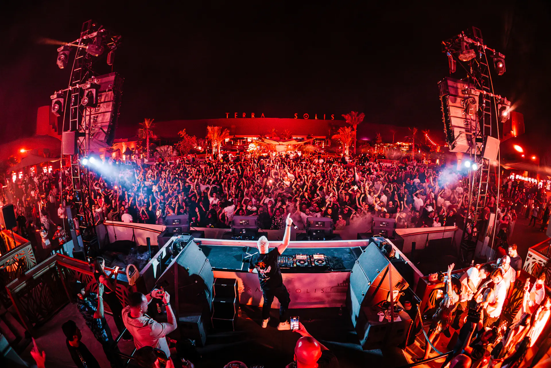 Scott Forshaw performing under blue laser stage lighting